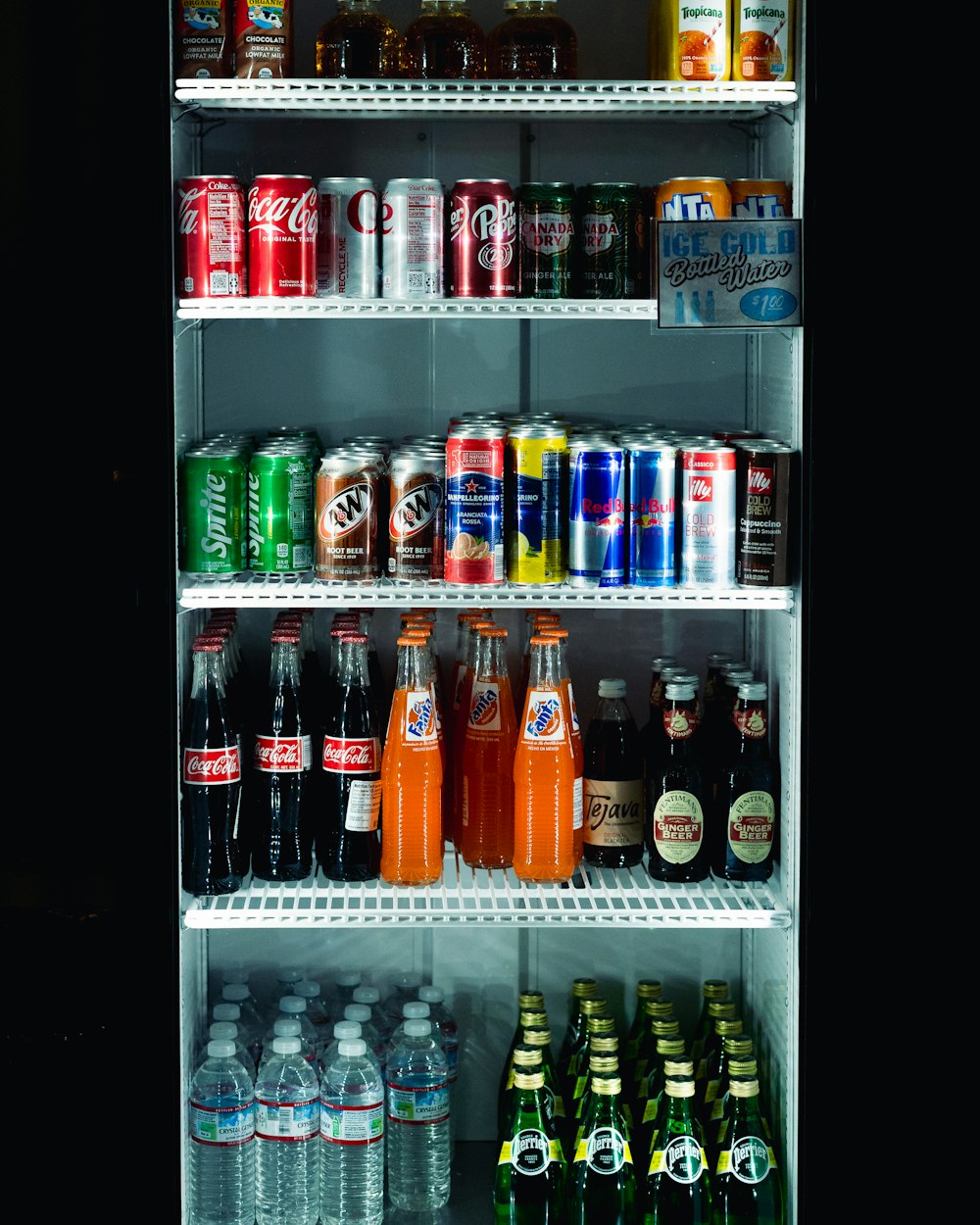 Glass-door refrigerated cooler stocked with cold drinks